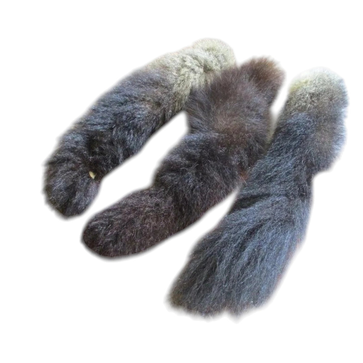 Three natural fur tails with a gradient color transition from dark brown to light beige, arranged on a plain white background.