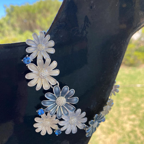 White and blue enamel daisy trim with blue rhinestones