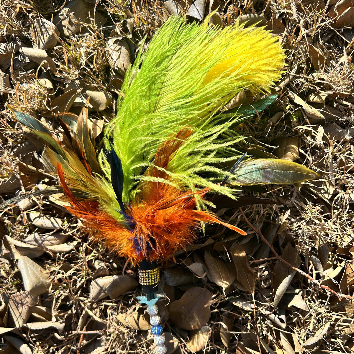 colourful feather cat teaser with yellow and green ostrich feathers and other colourful feathers
